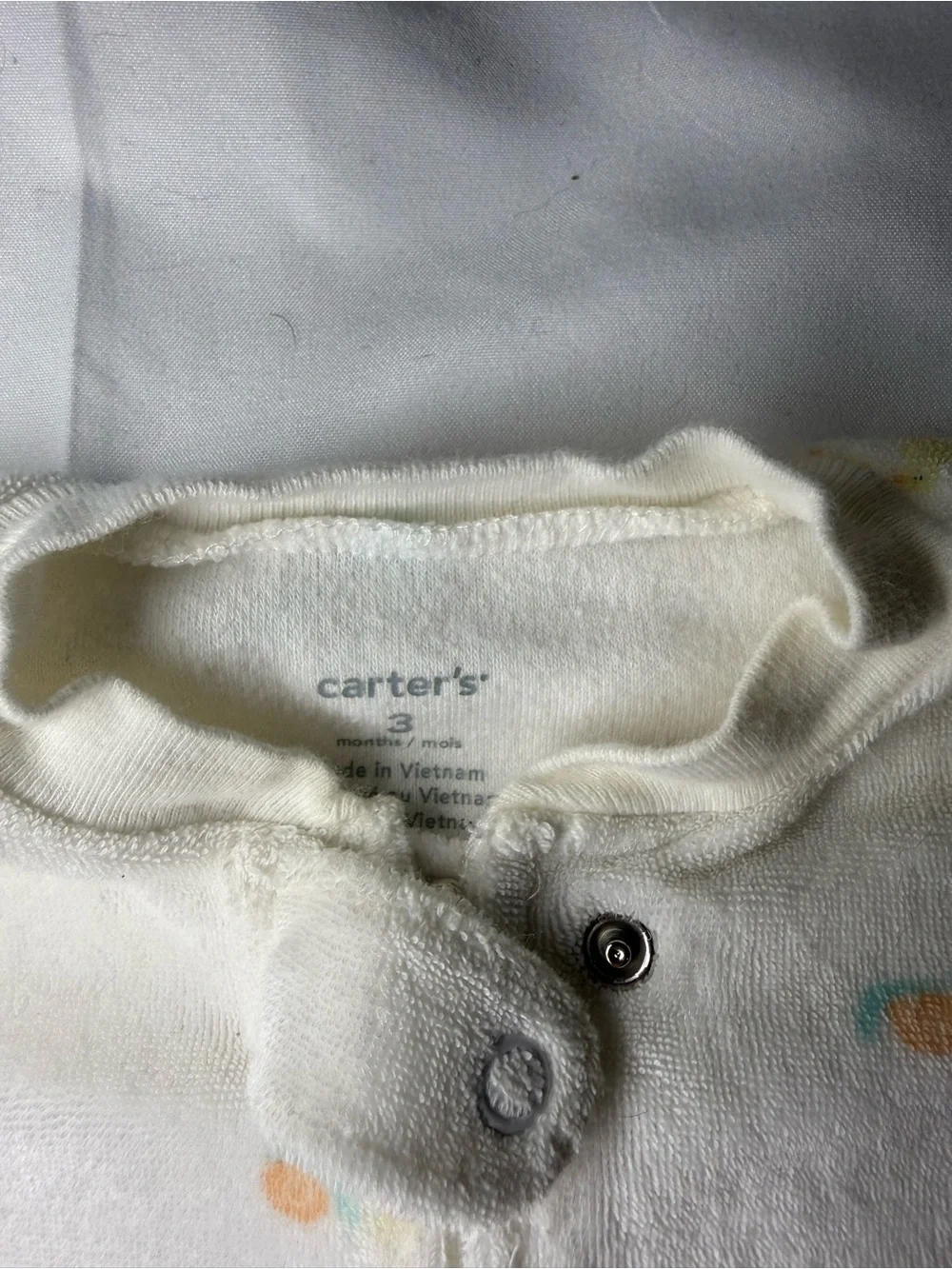 Carter's White Plush Footed One-Piece with Pastel Yellow & Blue Accents